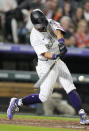 Colorado Rockies' Ezequiel Tovar connects for a single off San Diego Padres starting pitcher Sean Manaea in the fourth inning of a baseball game Friday, Sept. 23, 2022, in Denver. (AP Photo/David Zalubowski)