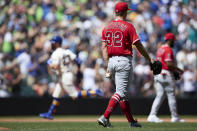 Seattle Mariners' Jesse Winker rounds the bases behind after hitting a grand slam against the Los Angeles Angels on a pitch from Tucker Davidson (32) during third inning of a baseball game, Sunday, Aug. 7, 2022, in Seattle. (AP Photo/John Froschauer)