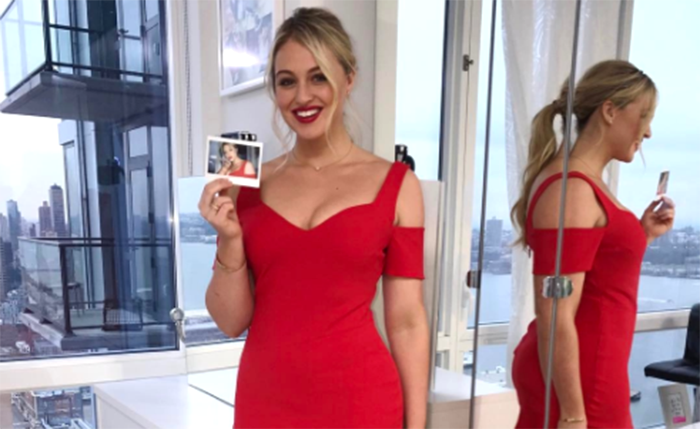 Iskra in a fitting red dress