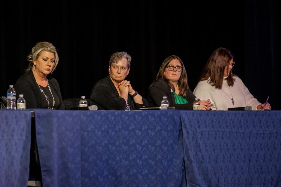 Members of the Steering Committee listen during the donation distribution plan town hall at the Oxford High School Auditorium in Oxford on Monday March 21, 2022. The fund will be distributed to those affected by the Nov. 30, 2021 shooting.