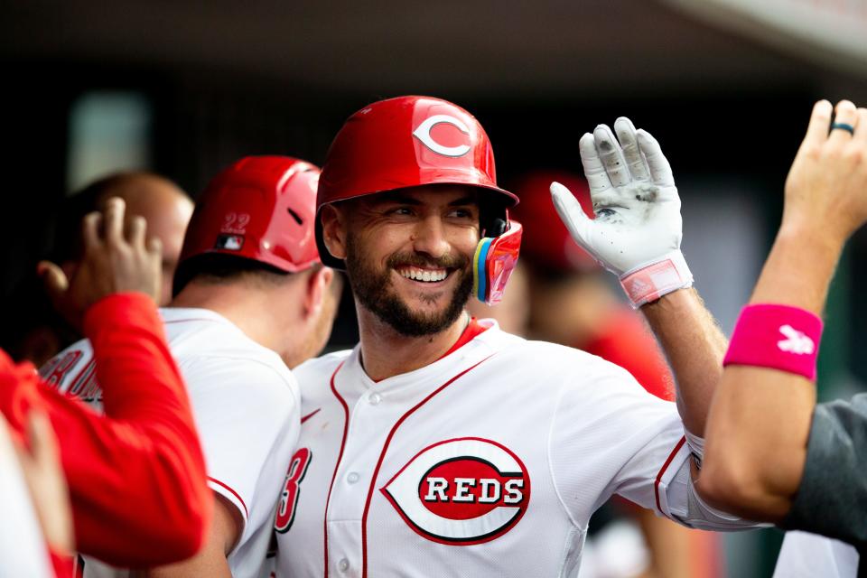 Cincinnati Reds right fielder Albert Almora Jr. (3) high fives teammates after hitting a game tying solo home run in the fifth inning of the MLB game between the Cincinnati Reds and the Los Angeles Dodgers in Cincinnati at Great American Ball Park on Wednesday, June 22, 2022. 