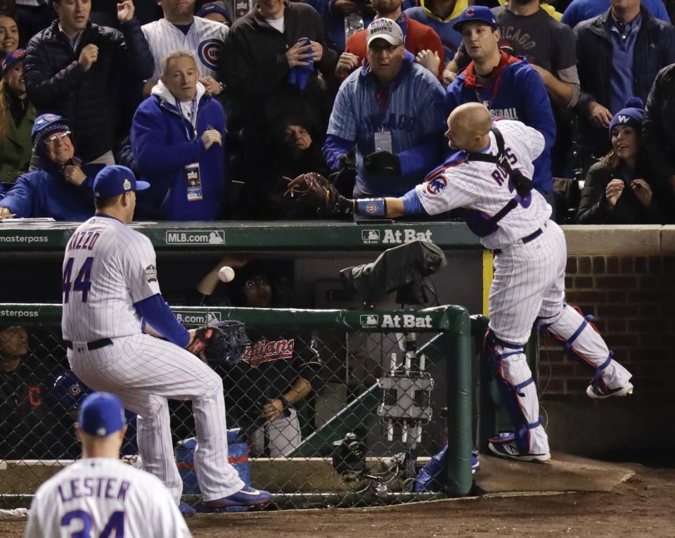 David Ross and Anthony Rizzo prove that two gloves are better than one. (AP)