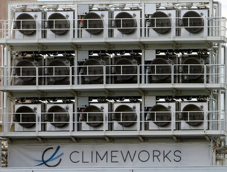 A facility for capturing CO2 from air of Swiss Climeworks AG is placed on the roof of a waste incinerating plant in Hinwil, Switzerland July 18, 2017. REUTERS/Arnd Wiegmann