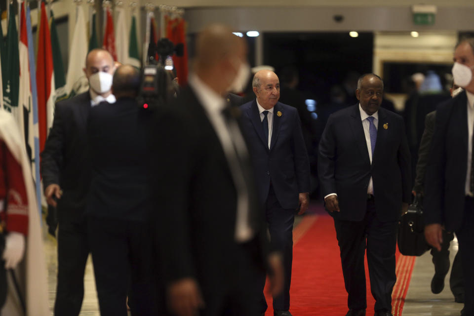 Algerian president Abdelmadjid Tebboune, centre, arrives to attend the Arab Summit, in Algiers, Algeria, Tuesday, 1 Nov., 2022. Arab leaders are meeting in Algeria at the 31st summit of the Arab League. They're seeking common ground on divisive issues in the region with the backdrop of rising inflation, food and energy shortages, drought and soaring cost of living across the Middle East and Africa. The 22-member League last held its summit in 2019. (AP Photo/Anis Belghoul)
