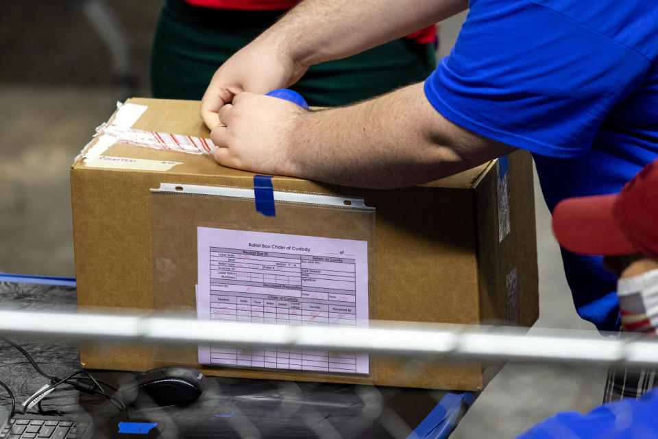 PHOENIX, AZ - MAY 01: A contractor working for Cyber Ninjas, who was hired by the Arizona State Senate unboxes ballots from the 2020 general election at Veterans Memorial Coliseum on May 1, 2021 in Phoenix, Arizona.  / Credit: COURTNEY PEDROZA / Getty Images