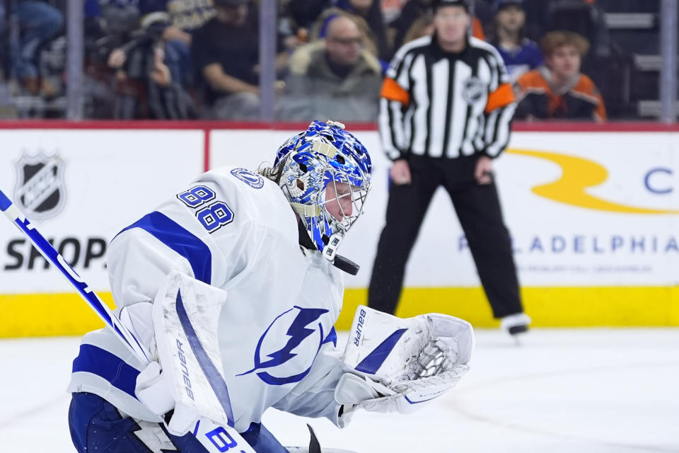 Tampa Bay Lightning's Andrei Vasilevskiy blocks a shot during the second period of an NHL hockey game against the Philadelphia Flyers, Tuesday, Jan. 23, 2024, in Philadelphia. (AP Photo/Matt Slocum)