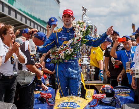 May 29, 2016; Indianapolis, IN, USA; IndyCar Series driver Alexander Rossi celebrates after winning the 100th running of the Indianapolis 500 at Indianapolis Motor Speedway. Mandatory Credit: Mark J. Rebilas-USA TODAY Sports