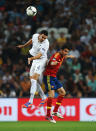 DONETSK, UKRAINE - JUNE 23: Adil Rami of France and Cesc Fabregas of Spain jump for the ball during the UEFA EURO 2012 quarter final match between Spain and France at Donbass Arena on June 23, 2012 in Donetsk, Ukraine. (Photo by Laurence Griffiths/Getty Images)