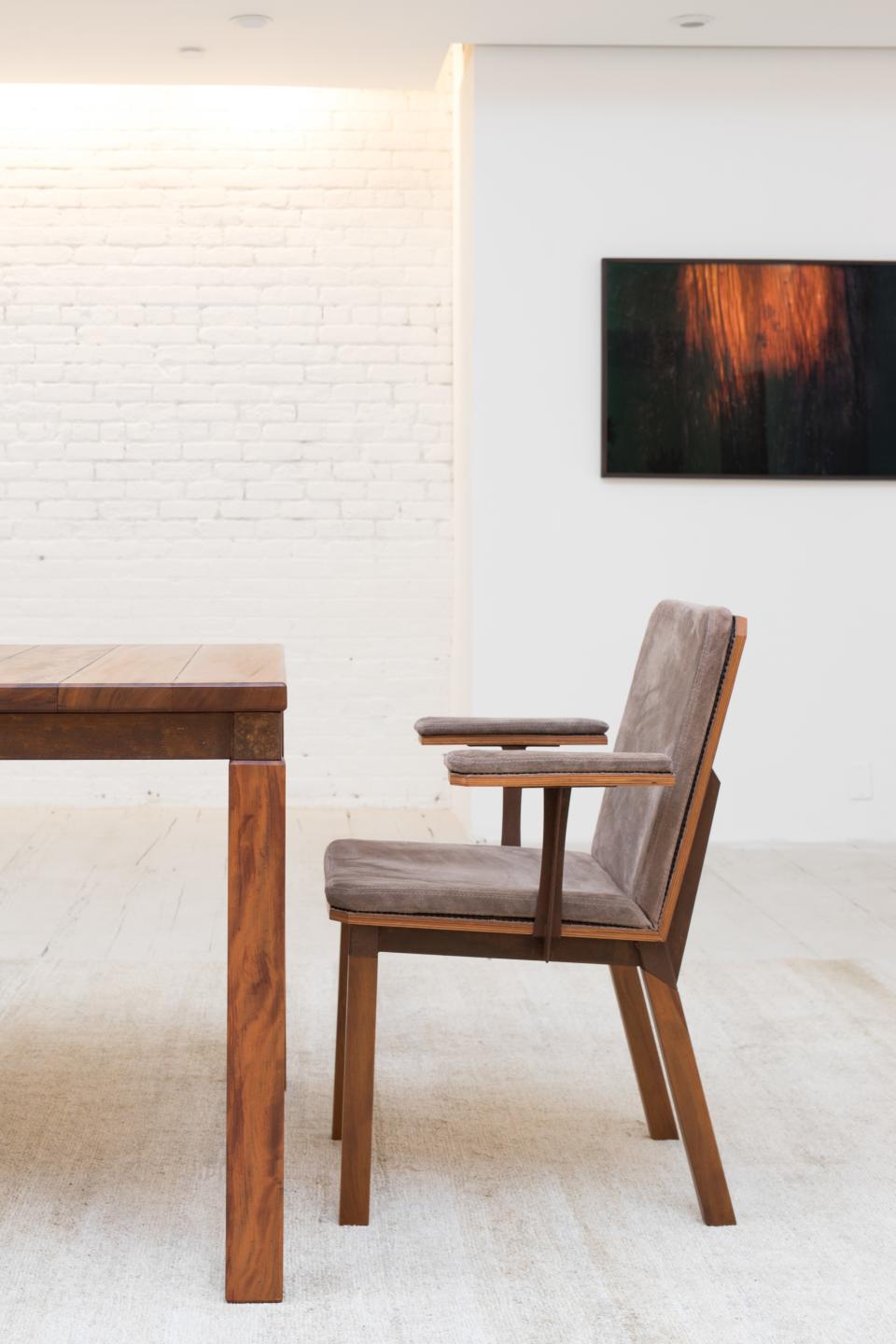 "In the first prototype, the leather was the color of the wood," says Motta of the chair design. "But Carlos said, 'I know you like it but it won’t work in New York. I want gray.' And when I come here and saw it, it’s so perfect in New York. It has the feel of the city."