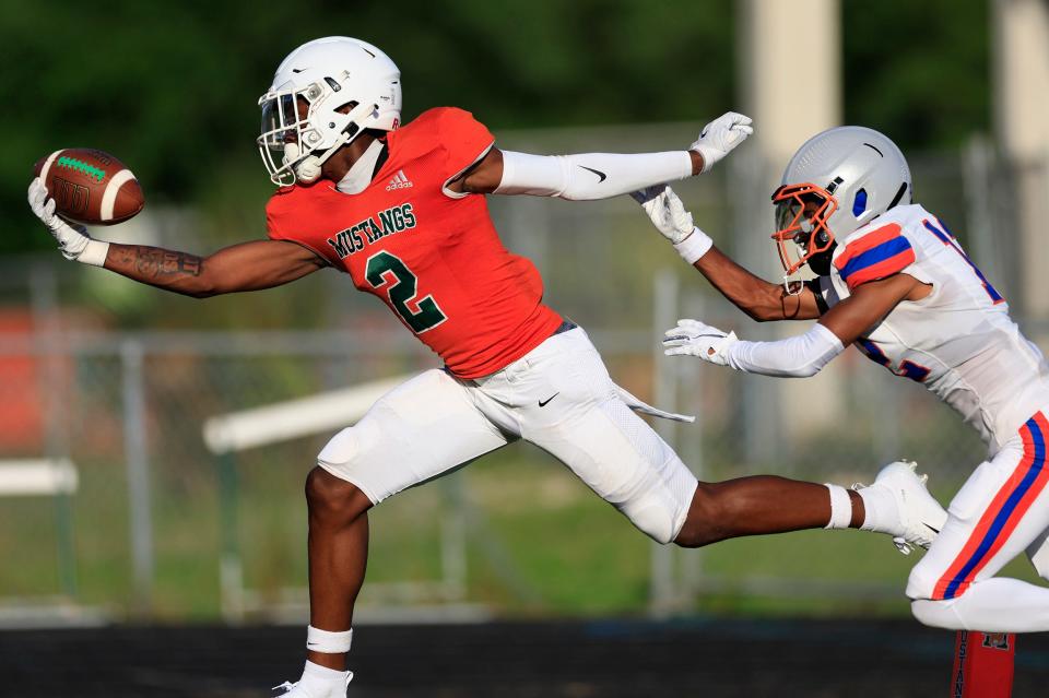 Jamie Ffrench  of Jacksonville, Florida, makes a one-handed touchdown catch in a game last season. The five-star prospect pledged to Texas on Friday, becoming the second five-star receiving prospect in the Longhorns' 2025 class.