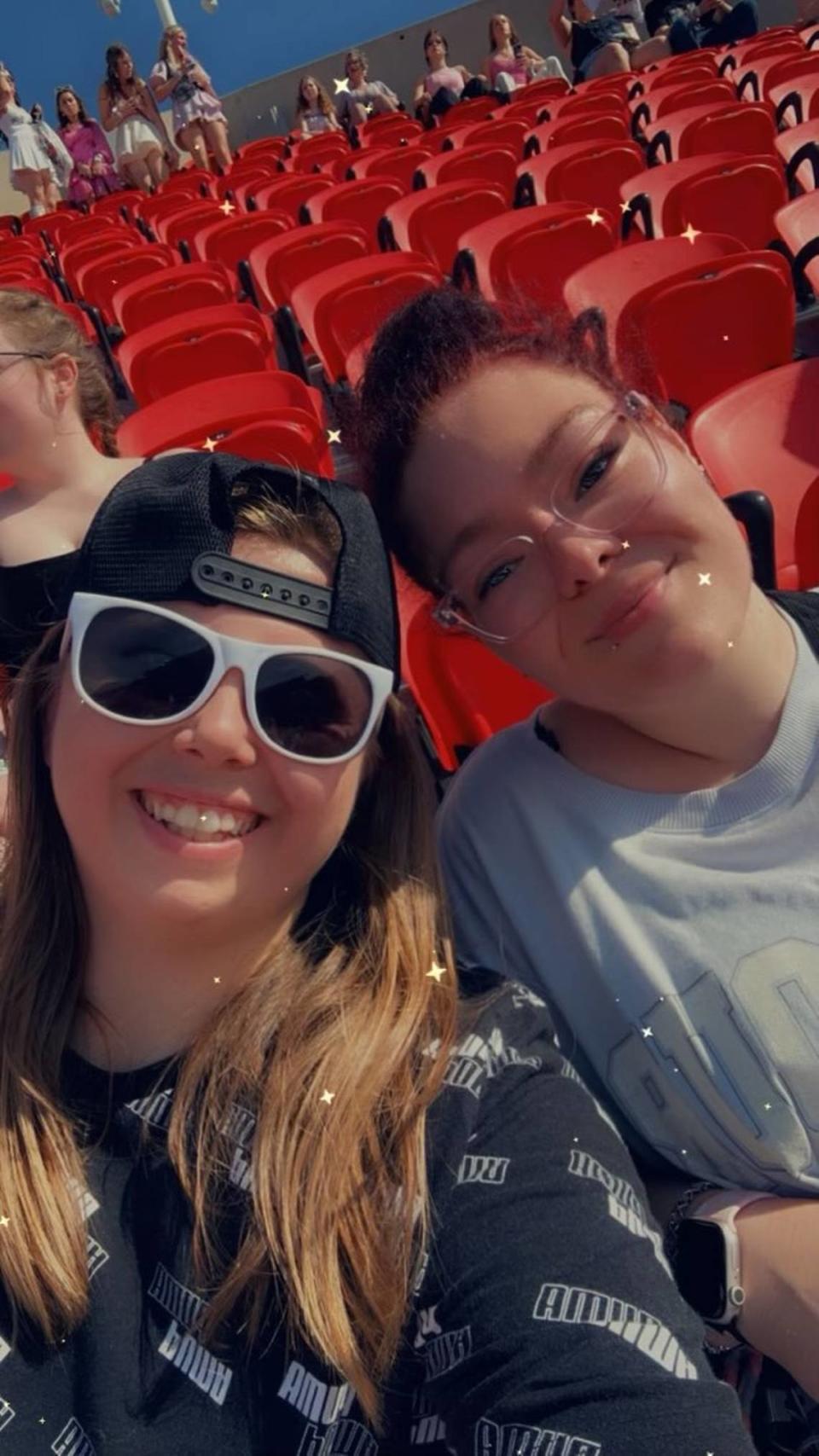 Elizabeth Poe, left, a sheriff’s deputy in Jasper County, Missouri, proposed to her girlfriend, Jordan Dragoo, as Taylor Swift sang “Love Story” at Friday night’s Eras Tour concert at GEHA Field at Arrowhead Stadium.