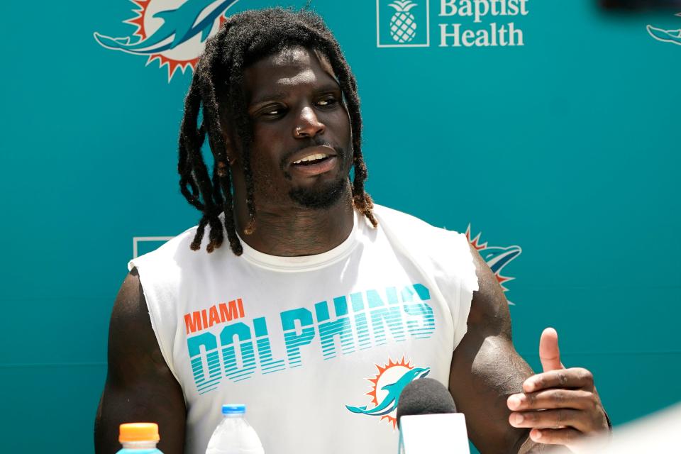 Miami Dolphins wide receiver Tyreek Hill talks with the news media at the NFL football team's practice facility, Thursday, July 28, 2022, in Miami Gardens, Fla.