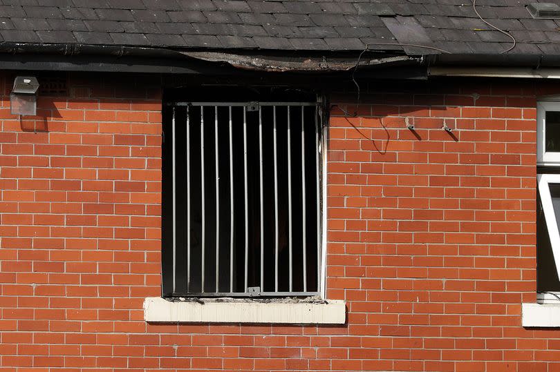 The damaged house in Bury