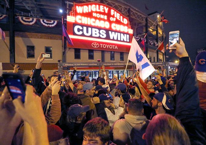 Cubs fans react to the franchise's first World Series win since 1908. (AP)