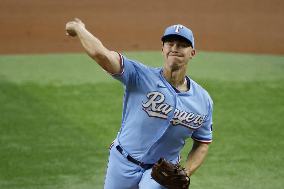 Texas Rangers starting pitcher Glenn Otto pitches against the Washington Nationals during the first inning of a baseball game Sunday, June 26, 2022, in Arlington, Texas. (AP Photo/Michael Ainsworth)