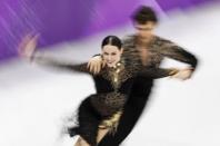 Figure Skating - Pyeongchang 2018 Winter Olympics - Ice Dance short dance competition - Gangneung Ice Arena - Gangneung, South Korea - February 19, 2018 - Tessa Virtue and Scott Moir of Canada perform. REUTERS/Damir Sagolj