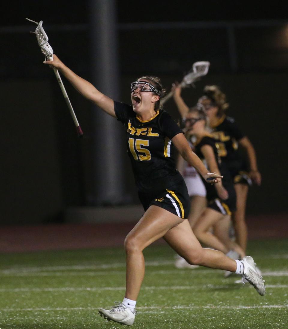 Honeoye Falls-Lima's Paige Kidd celebrates as the buzzer sounds giving the Cougars the win over Palmyra-Macedon 15-6 in their Section V Class C Finals game Wednesday, May 31, 2023 at East Rochester High School.