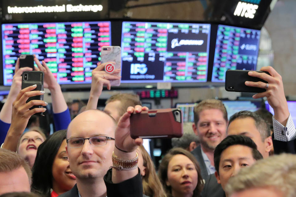 Guests use their phones during the Pinterest Inc. IPO on the floor of the New York Stock Exchange (NYSE) in New York, U.S., April 18, 2019. REUTERS/Brendan McDermid