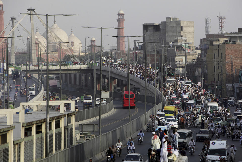 Supporters of Pakistani religious group march towards Islamabad from Lahore, Pakistan, Wednesday, Aug. 29, 2018. Thousands of Islamists in Pakistan launched a march toward the capital on Wednesday to protest a far-right Dutch lawmaker's plans to hold a Prophet Muhammad cartoon contest later this year. (AP Photo/K.M. Chaudary)