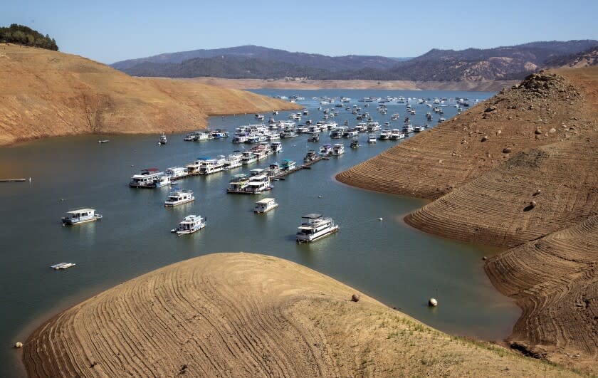 OROVILLE, CA - JUNE 29: Houseboats on the water at a receding Lake Oroville, which stands at 33 percent full and 40 percent of historical average when this photograph was taken on Tuesday, June 29, 2021 in Oroville, CA. (Brian van der Brug / Los Angeles Times)