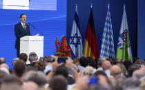 Israeli President Isaac Herzog delivers his speech during a ceremony to commemorate the victims of the attack by Palestinian militants on the 1972 Munich Olympics in Fuerstenfeldbruck near Munich, Germany, Monday, Sept. 5, 2002. The German and Israeli presidents are to join relatives of the 11 Israeli athletes killed in the attack by Palestinian militants on the commemoration event marking the 50th anniversary of the attack. (Sven Hoppe/dpa via AP)