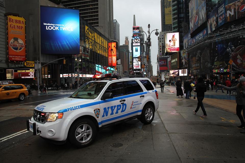 NEW YORK, NY - OCTOBER 29: A police car sits in Times Square as Hurricane Sandy begins to affect the area on October 29, 2012 in New York City. The storm, which threatens 50 million people in the eastern third of the U.S., is expected to bring days of rain, high winds and possibly heavy snow. New York Governor Andrew Cuomo announced the closure of all New York City will bus, subway and commuter rail service as of Sunday evening. (Photo by Spencer Platt/Getty Images)