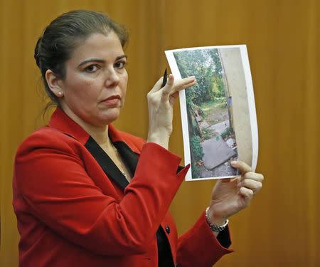 Prosecutor Marie Mato shows evidence during a bail hearing for Marc Wabafiyebazu in Miami, Florida May 27, 2015. REUTERS/Al Diaz/Pool