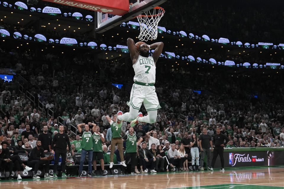 Boston Celtics guard Jaylen Brown goes up for a dunk against the Dallas Mavericks during the first half of Game 1 of basketball's NBA Finals on Thursday, June 6, 2024, in Boston. (AP Photo/Charles Krupa)