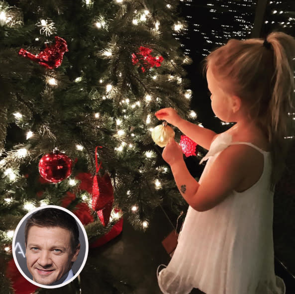 <p>Jeremy Renner knows that Christmas is best seen through the eyes of a child. The <i>Arrival</i> actor posted this sweet snap of his 3-year-old daughter, Ava, decorating their tree on Thanksgiving. “Blessings to you all and your families this holiday season,” he wrote, along with the hashtags #treetrimming and #turkeyday. (Photo: <a rel="nofollow noopener" href="https://www.instagram.com/p/BNXF44Yjs__/" target="_blank" data-ylk="slk:Instagram;elm:context_link;itc:0;sec:content-canvas" class="link ">Instagram</a>/Getty Images) </p>