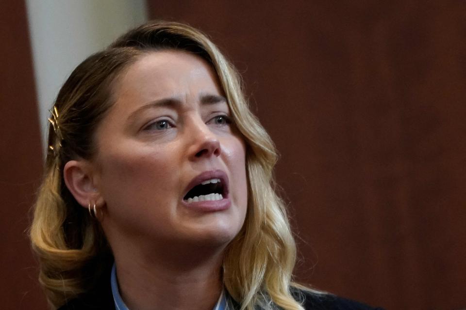 Actor Amber Heard testifies about the first time she says her ex-husband, actor Johnny Depp, hit her, at Fairfax County Circuit Court during a defamation case against her by Depp in Fairfax, Virginia, on May 4, 2022.