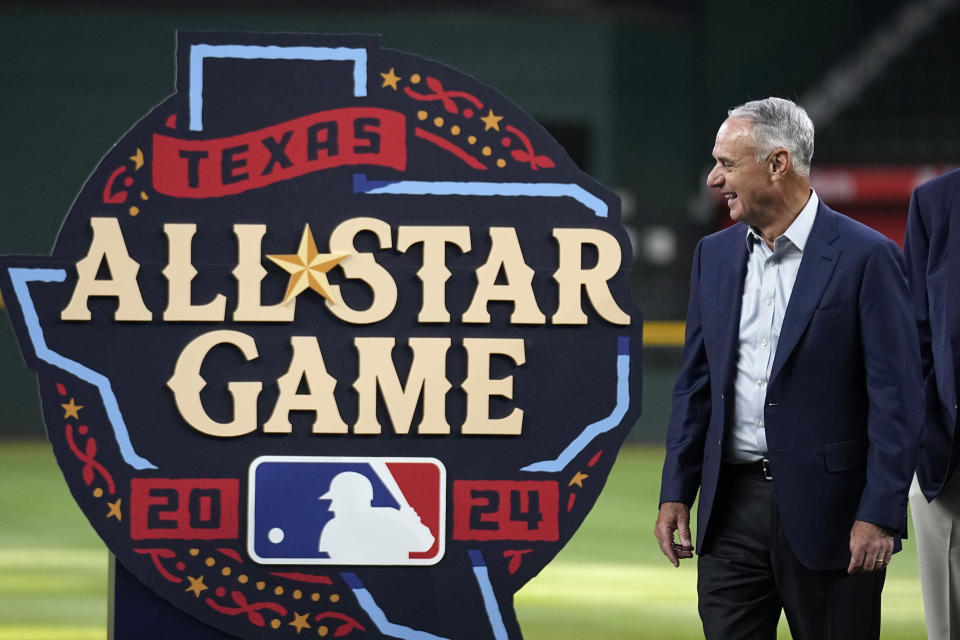 Major League Baseball Commissioner Rob Manfred smiles during the unveiling of the 2024 All-Star baseball game logo, Thursday, July 20, 2023, in Arlington, Texas. The MLB All-Star Game has grown into a truly Texas-sized event since the last time the Rangers hosted the midsummer classic. The countdown is on for 2024 game on July 16, 2024, and all of the activities around the game. (AP Photo/Tony Gutierrez)