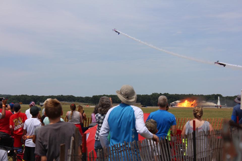 Airplanes continue over the explosion of Chris Darnell's truck. (Tom Campbell / Facebook)