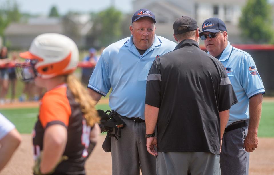 LeRoy head coach Doug Hageman argues a close call at first base with the umpires during the Class 1A softball state semifinals Friday, June 2, 2023 at the Louisville Slugger Sports Complex in Peoria. The Tigers advanced to the Saturday title game with a 10-0 victory in five innings.