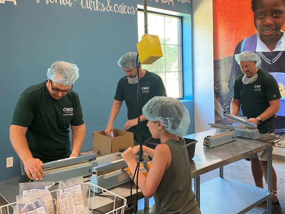 Volunteers pack food aid for the people of Ukraine on June 22, 2022, at Meals from the Heartland in West Des Moines. The organization packages and distributes meals to people in need in Iowa and around the world, and had a goal between June 20 and 25 of packing 285,000 meals to send to Ukraine in addition to hundreds of thousands already sent.