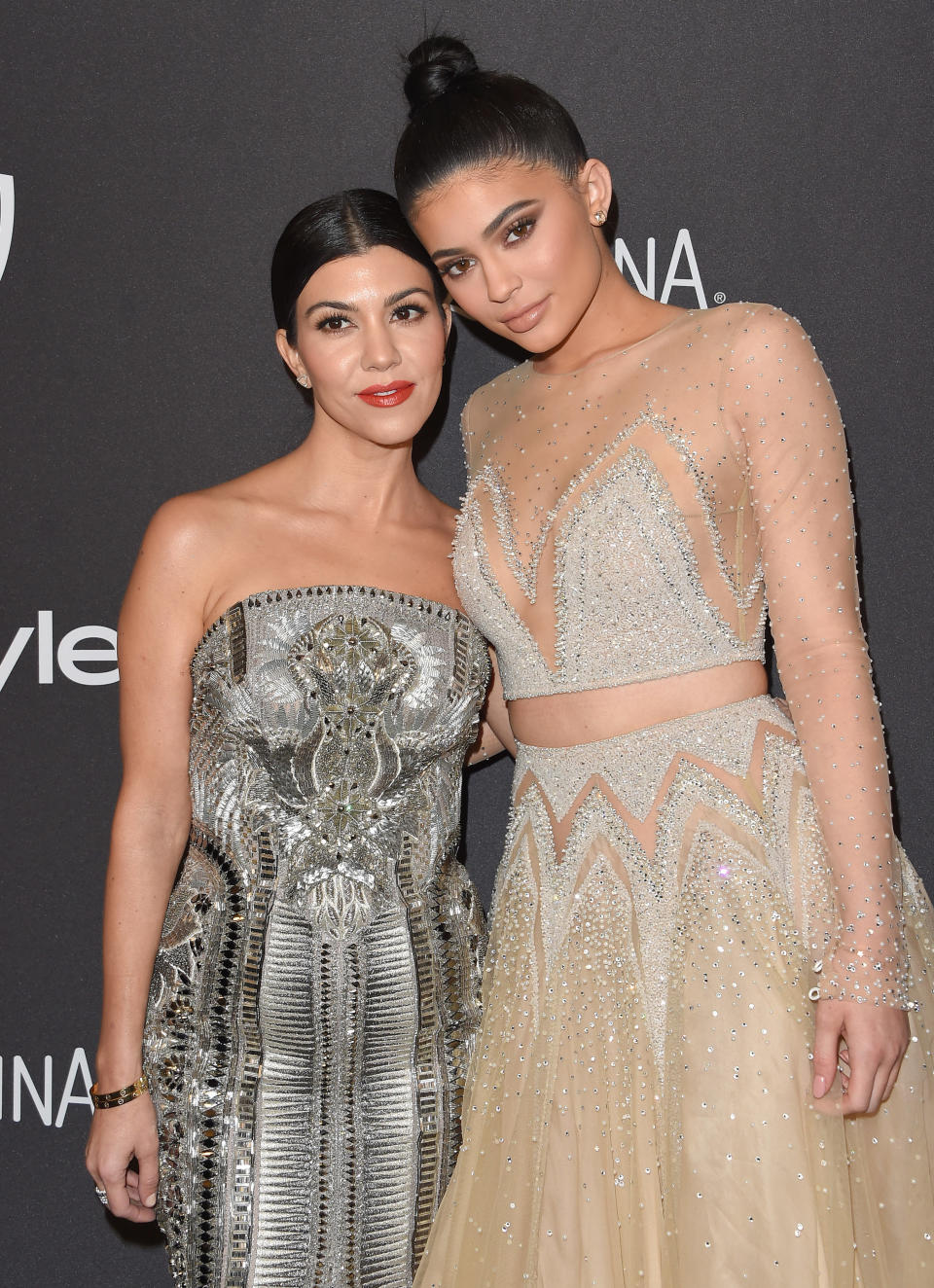 TV personalities Kourtney Kardashian and Kylie Jenner arrive at the 2016 InStyle And Warner Bros. 73rd Annual Golden Globe Awards Post-Party at The Beverly Hilton Hotel on January 10, 2016 in Beverly Hills, California. (Photo by Axelle/Bauer-Griffin/FilmMagic)