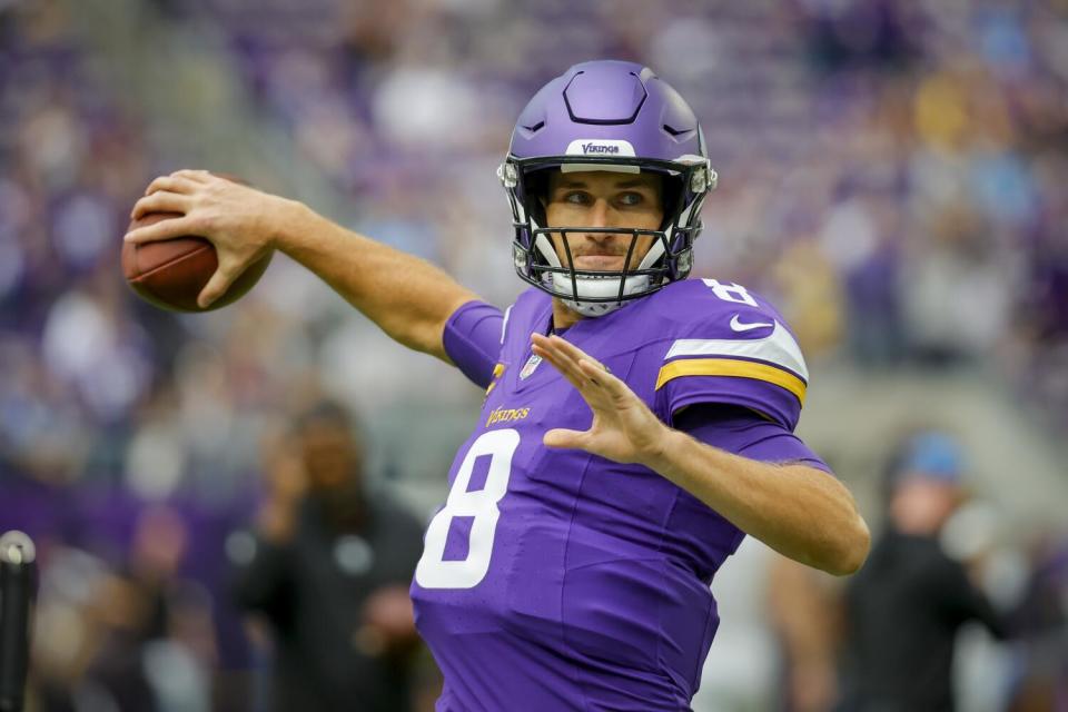 Minnesota Vikings quarterback Kirk Cousins warms up before a game.