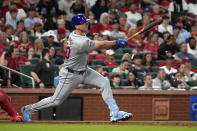 New York Mets' Pete Alonso follows through on a two-run double during the fifth inning of a baseball game against the St. Louis Cardinals Tuesday, May 7, 2024, in St. Louis. (AP Photo/Jeff Roberson)