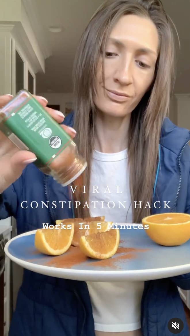 Person holding spice jar over sliced oranges, with text about a quick constipation remedy