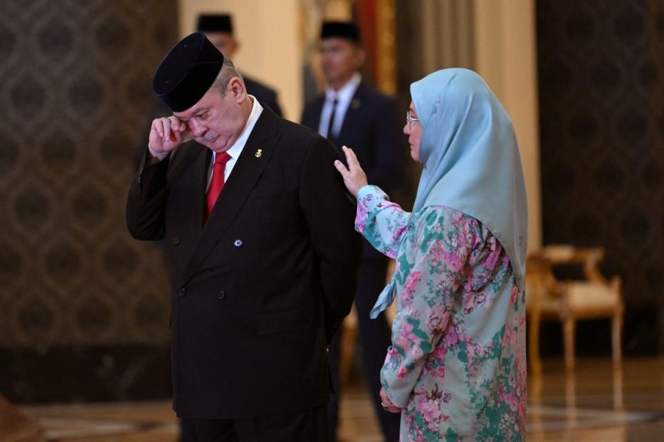 Sultan Ibrahim Iskandar of Johor, left, wipes his tears next to his sister Malaysia’s Queen Tunku Azizah Aminah Maimunah Iskandariah after the election for the next Malaysian king at the National Palace in Kuala Lumpur Friday, 27 October 2023 (AP)