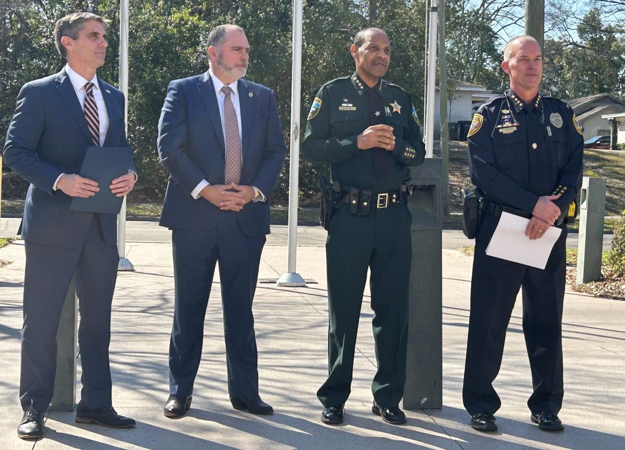 From left: Special Agent Mark Perez with the Florida Department of Law Enforcement, State Attorney Jack Campbell, Leon County Sheriff Walt McNeil and Tallahassee Police Chief Lawrence Revell stand in front of the Tallahassee Police Department headquarters.