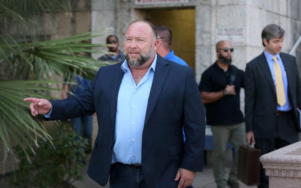 Jones steps outside of the Travis County Courthouse in Austin, Texas - Reuters