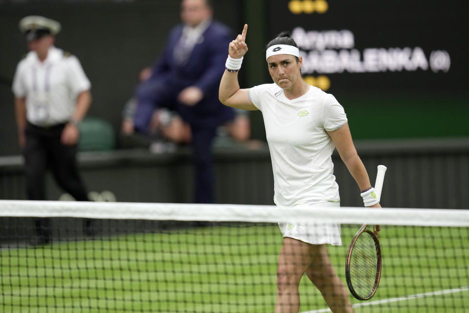 Tunisia's Ons Jabeur celebrates winning a set against Aryna Sabalenka of Belarus during their women's semifinal singles match on day eleven of the Wimbledon tennis championships in London, Thursday, July 13, 2023. (AP Photo/Kin Cheung)