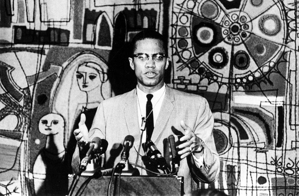 Malcolm X holds a news conference in the Tapestry Suite of Park Sheraton Hotel in New York City on March 12, 1964.