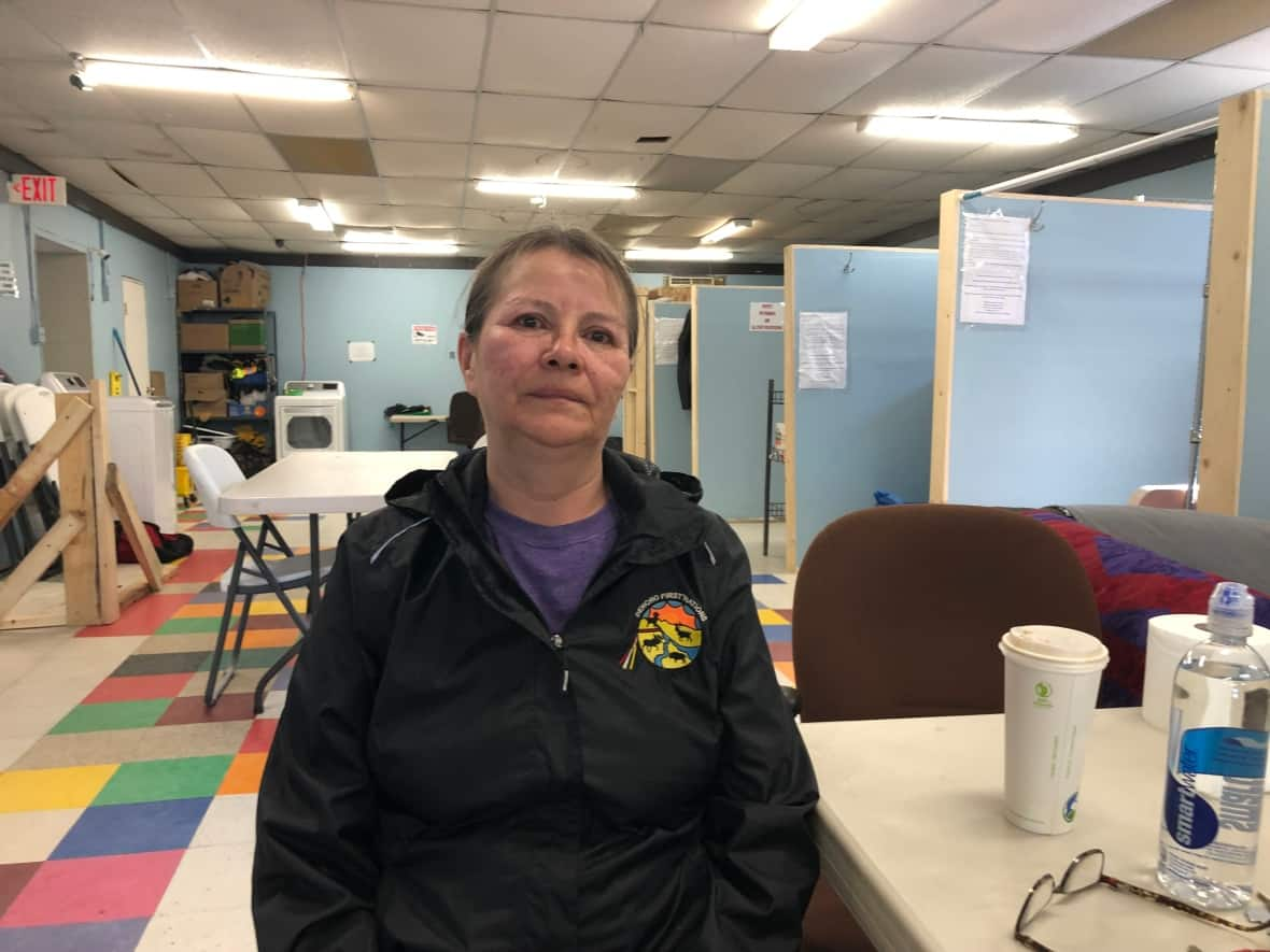 Rosa Wright runs the warming centre in Fort Simpson, N.W.T. As a possible evacuation looms, she found herself coming up with plans for all the clients of the centre.  (Luke Carroll/ CBC  - image credit)