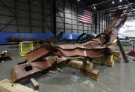 Twisted steel recovered from the World Trade Center sits inside Hangar 17 at New York's John F. Kennedy International Airport June 16, 2011. A program operated by the Port Authority of New York and New Jersey, The World Trade Center steel program, is selecting portions of the steel recovered from the Center and donating it to cities, towns, firehouses and museums around the U.S. and the world who request it for use in 911 memorial sites in time for the 10 year anniversary of the 2001 attacks. Picture taken June 16, 2011. (REUTERS/Mike Segar)