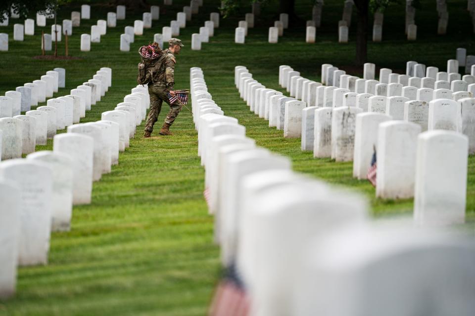 A member of the 3rd U.S. Infantry Regiment also known as “The Old Guard” takes part in a joint service “Flags-In” ceremony at Arlington National Cemetery on Thursday, May 25, 2023