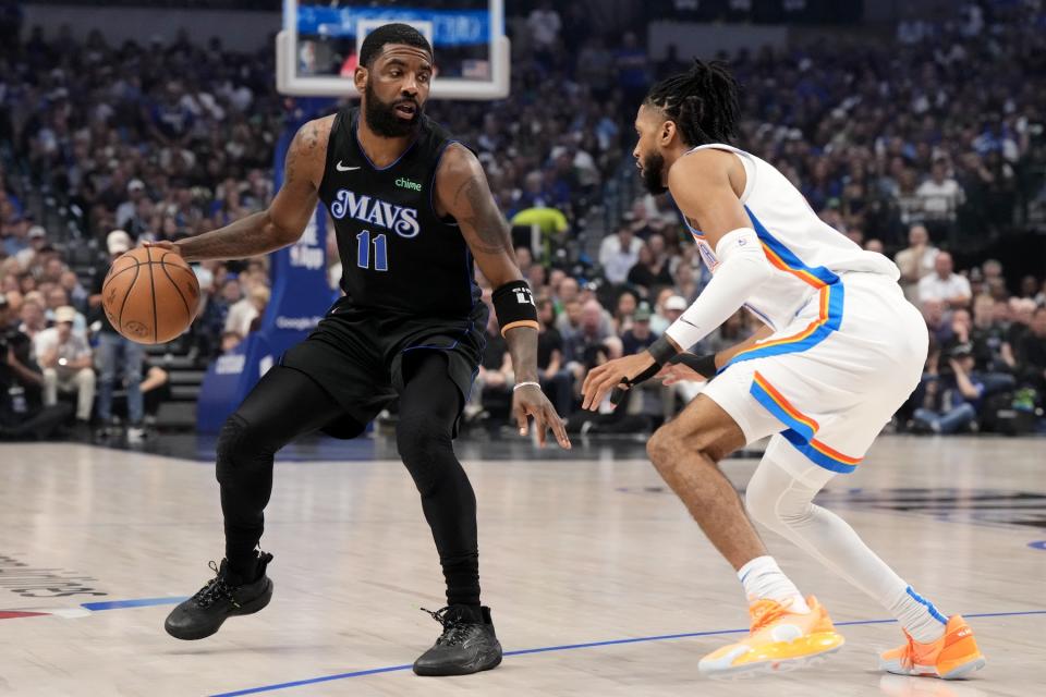 DALLAS, TEXAS - MAY 18: Kyrie Irving #11 of the Dallas Mavericks is defended by Isaiah Joe #11 of the Oklahoma City Thunder during the first half of Game Six of the Western Conference Second Round Playoffs at American Airlines Center on May 18, 2024 in Dallas, Texas. NOTE TO USER: User expressly acknowledges and agrees that, by downloading and or using this photograph, User is consenting to the terms and conditions of the Getty Images License Agreement. (Photo by Sam Hodde/Getty Images)