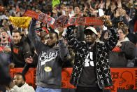 Cleveland Cavaliers' Darius Garland, left, and Donovan Mitchell celebrate a Cleveland Browns touchdown against the Pittsburgh Steelers during the first half of an NFL football game in Cleveland, Thursday, Sept. 22, 2022. (AP Photo/David Richard)