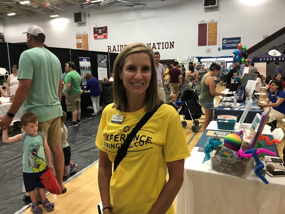 Spring Hill Chamber of Commerce executive director Becca Melton visits dozens of booths at the annual Experience Spring Hill event at Spring Hill High School, which drew a crowd of almost 1,000 on Saturday.