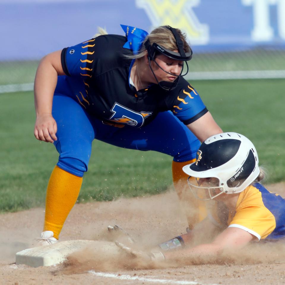 Philo third baseman Addison Shearer lays the tag on Peyton Brown during the sixth inning of a 15-9 win against host West Muskigum on Thursday in Falls Township. 